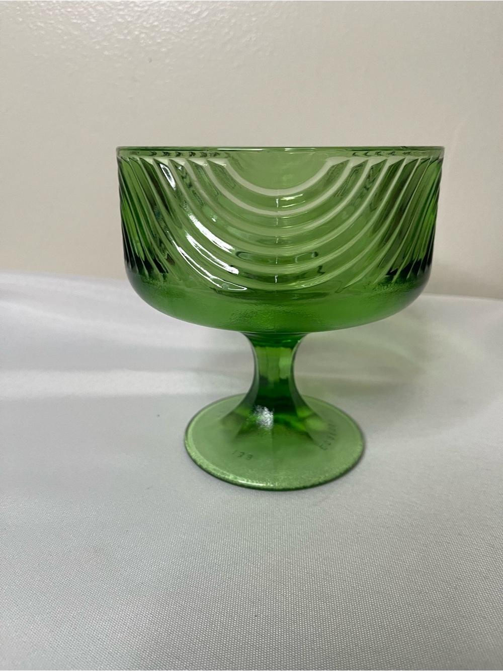 Vintage green glass pedestal compote or candy dish. Made by E O Brody.